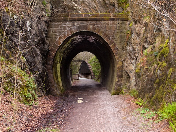 Tunnel and bridge on the
                    old railway path into Keswick